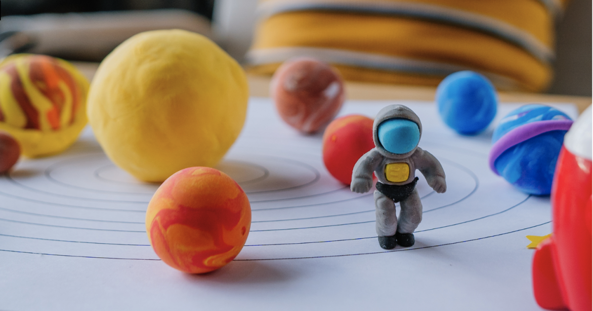 Astronaut and planets made from clay